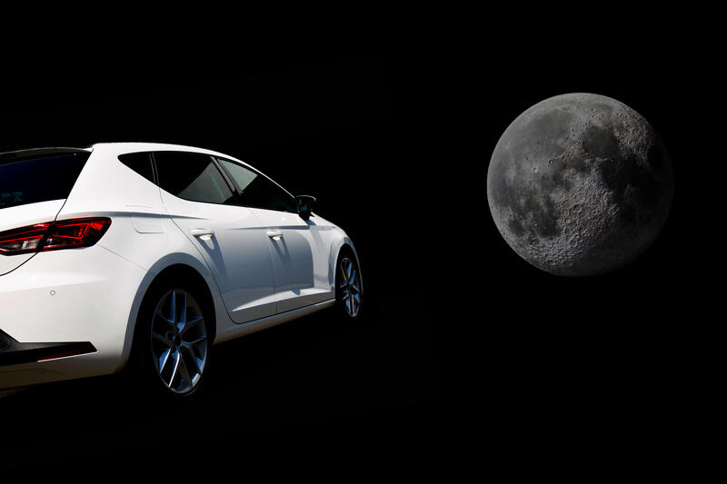 A car flying through space to the Moon