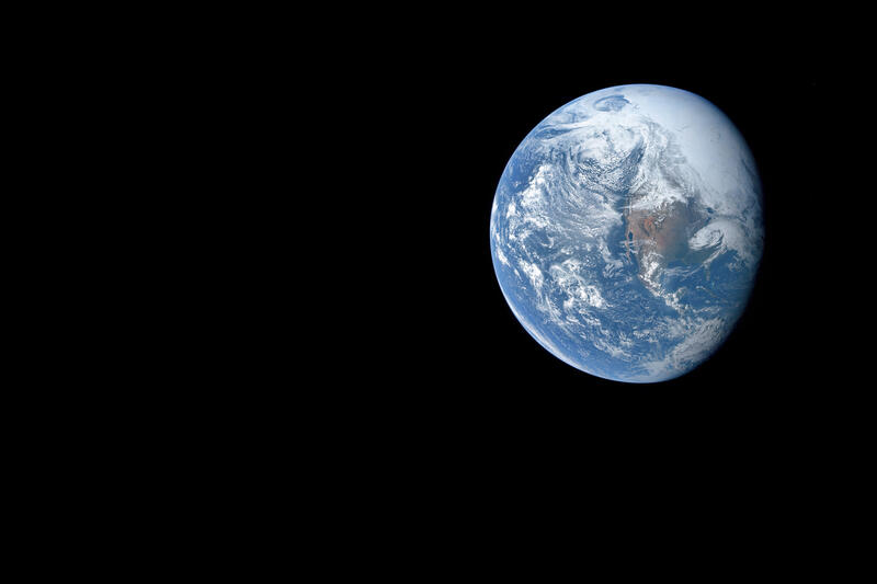 The Earth with no stars, just the blackness of space
