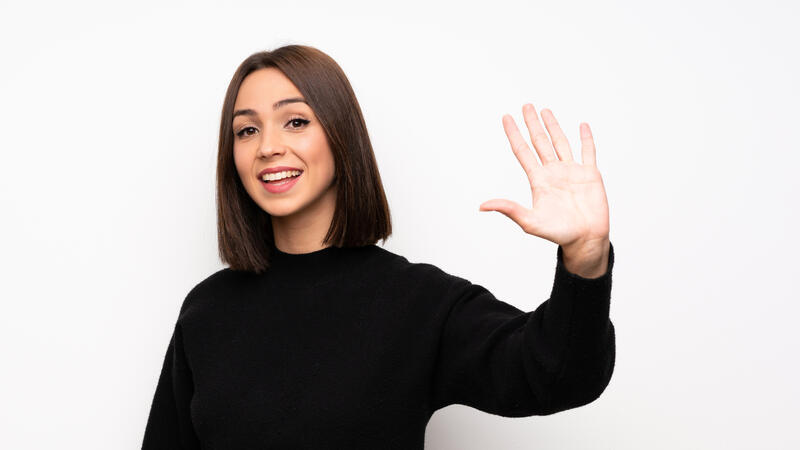 A woman waving her hand